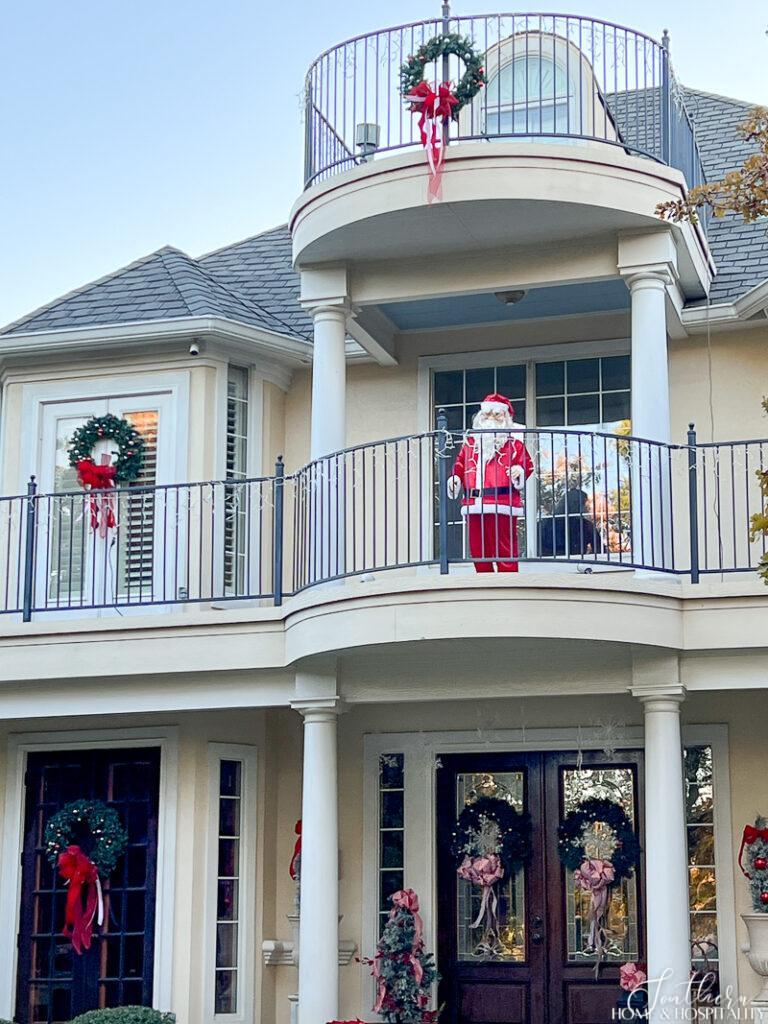 Life size Santa on porch balcony