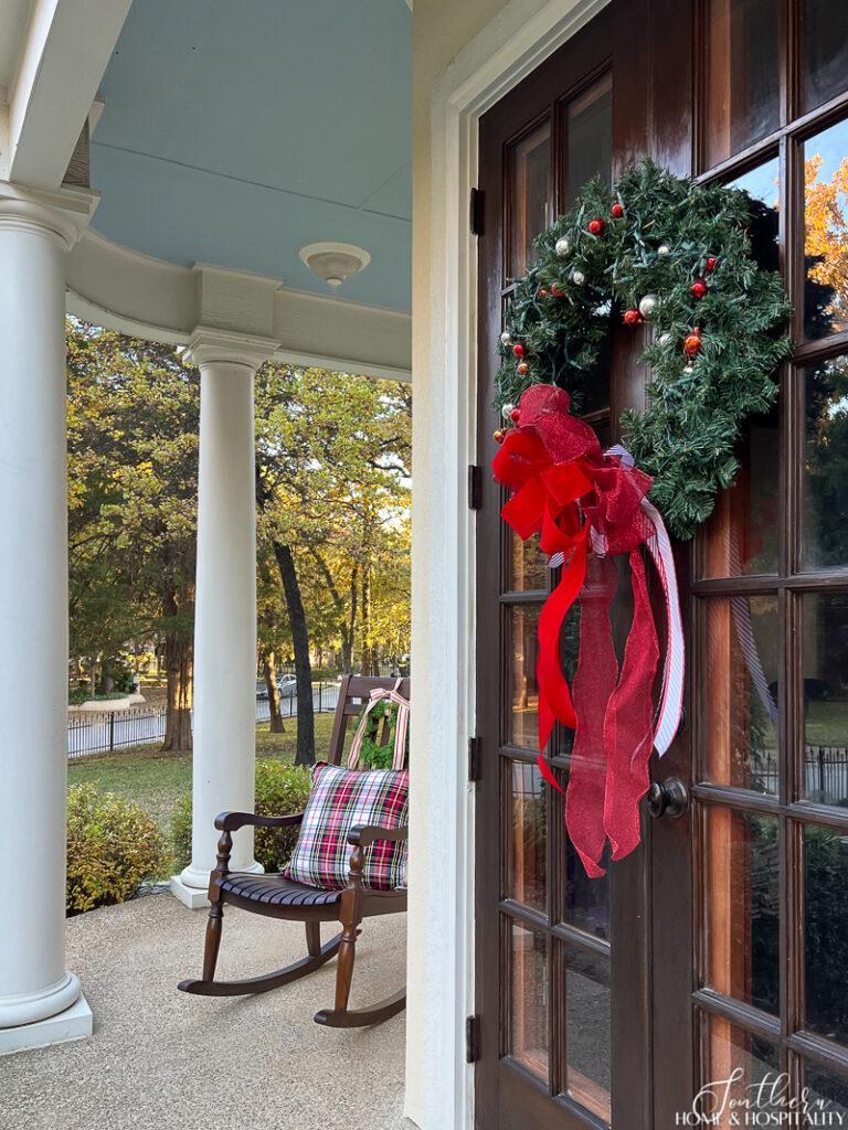 Christmas wreath on French doors on a porch
