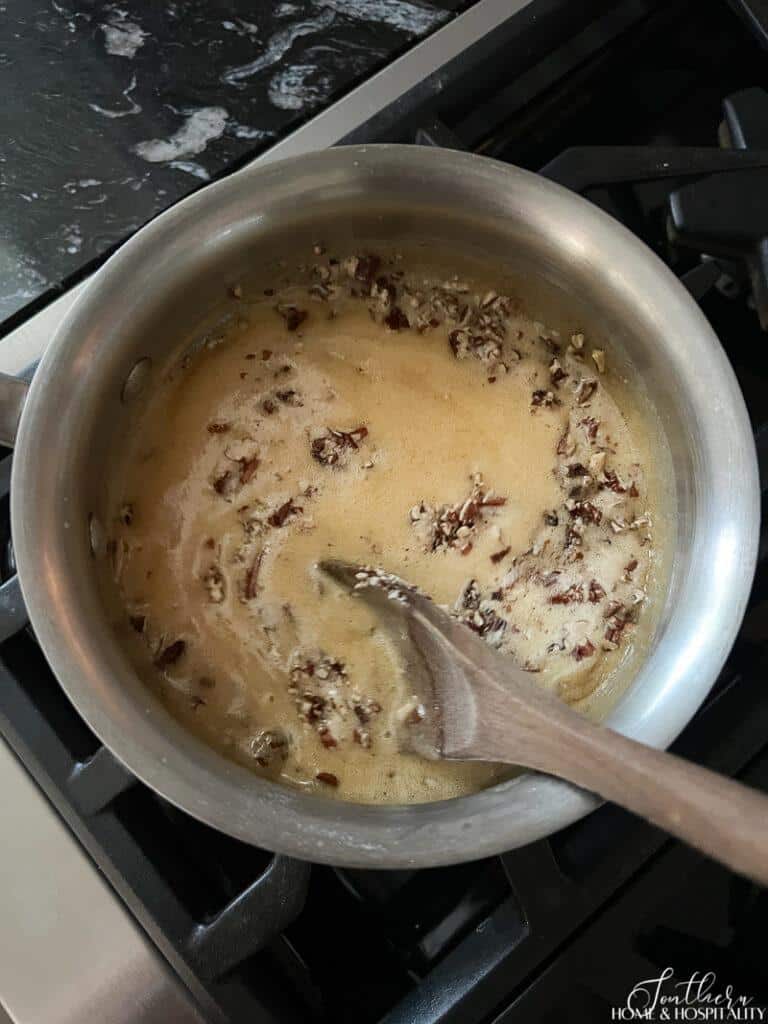 Adding chopped pecans and baking soda to cream sauce
