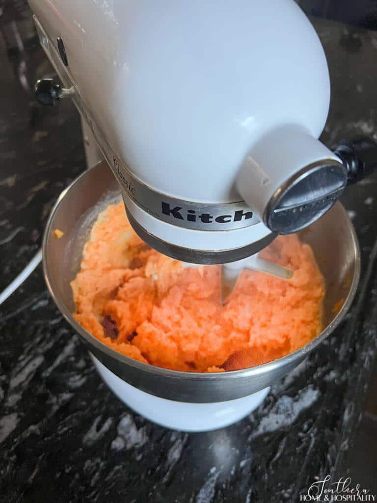 Mixing sweet potatoes and butter in stand mixer
