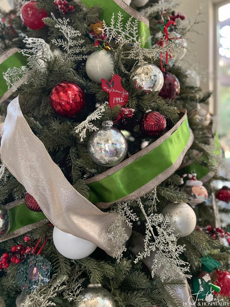 Green and champagne ribbon on a Christmas tree