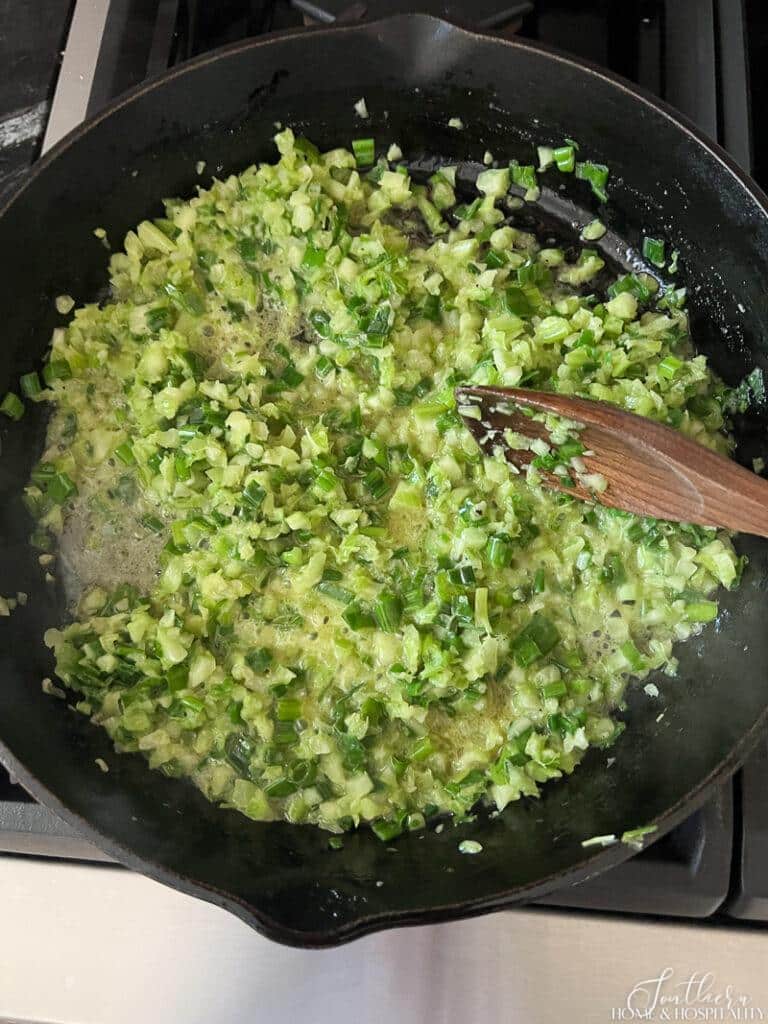 Green onions and celery sauteing in butter
