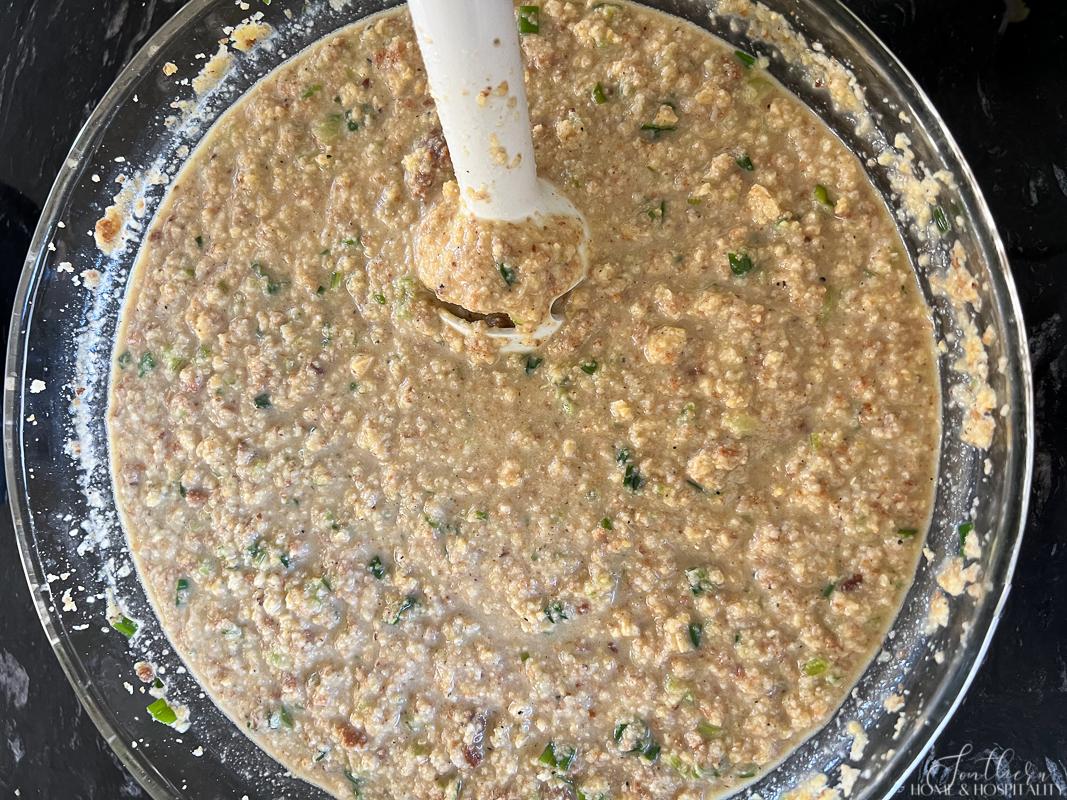 Mixing cornbread dressing with an immersion blender