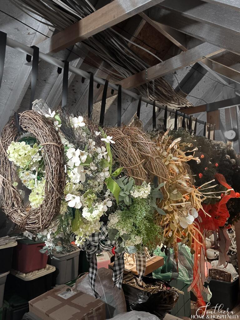 Wreaths hanging on a closet rod in attic