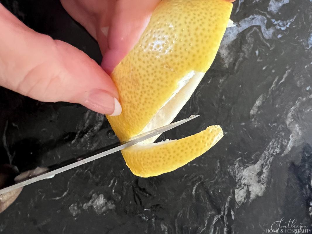 Cutting lemon peel into a strip