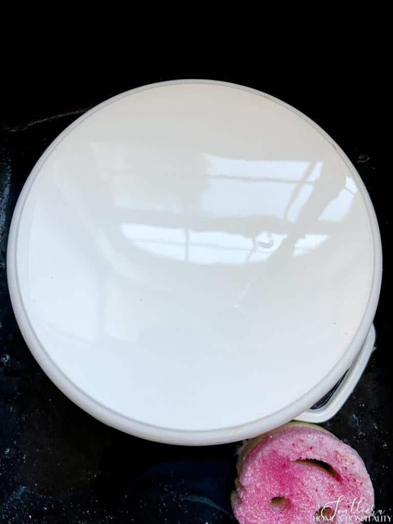 Cleaning bottom of pan with The Pink Stuff
