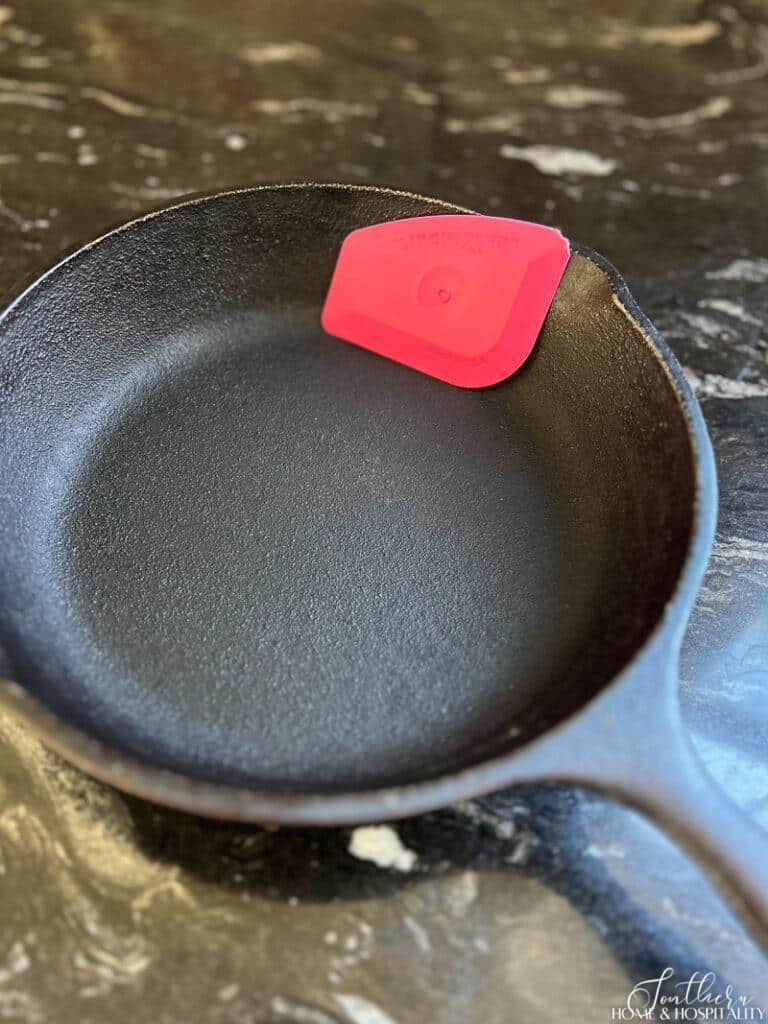 Lil Chizler scraper in cast iron pan