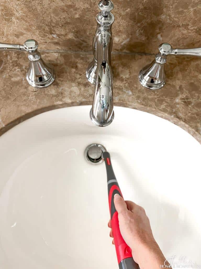 Using Rubbermaid power scrubber on bathroom sink