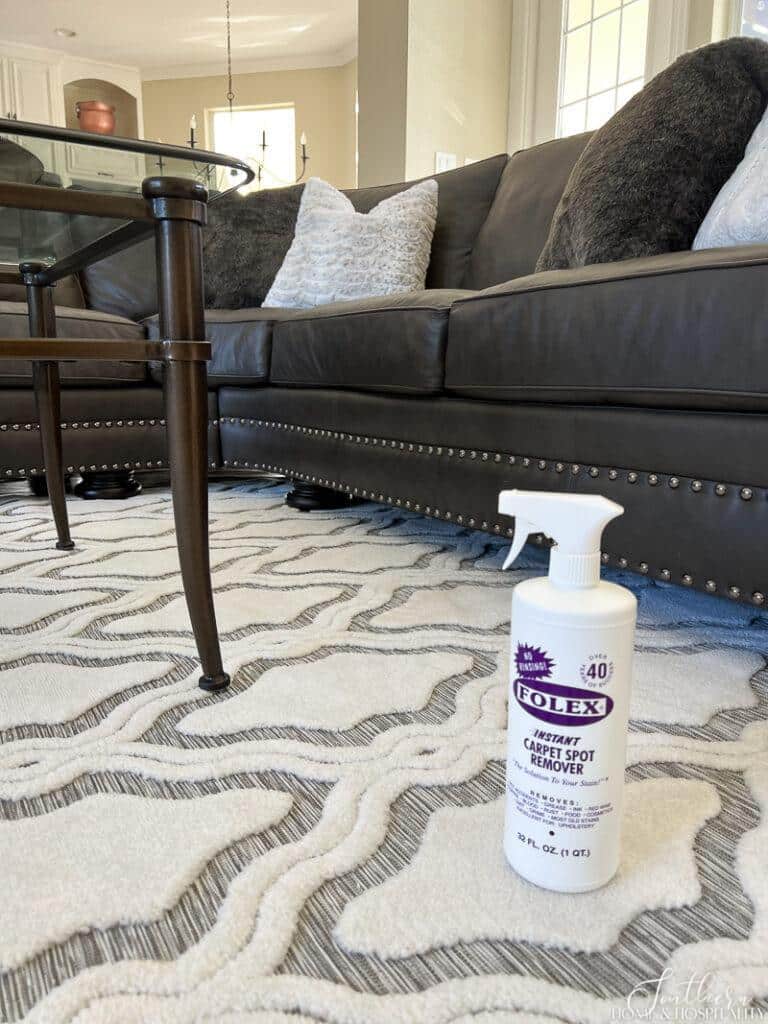 Folex carpet cleaner bottle sitting on rug