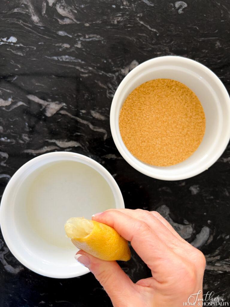Preparing lemon juice and cocktail rimming sugar
