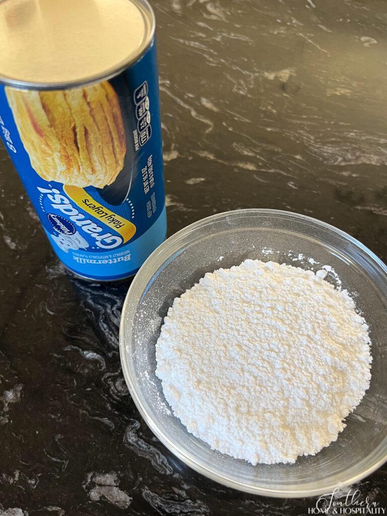 Canned biscuits and powdered sugar