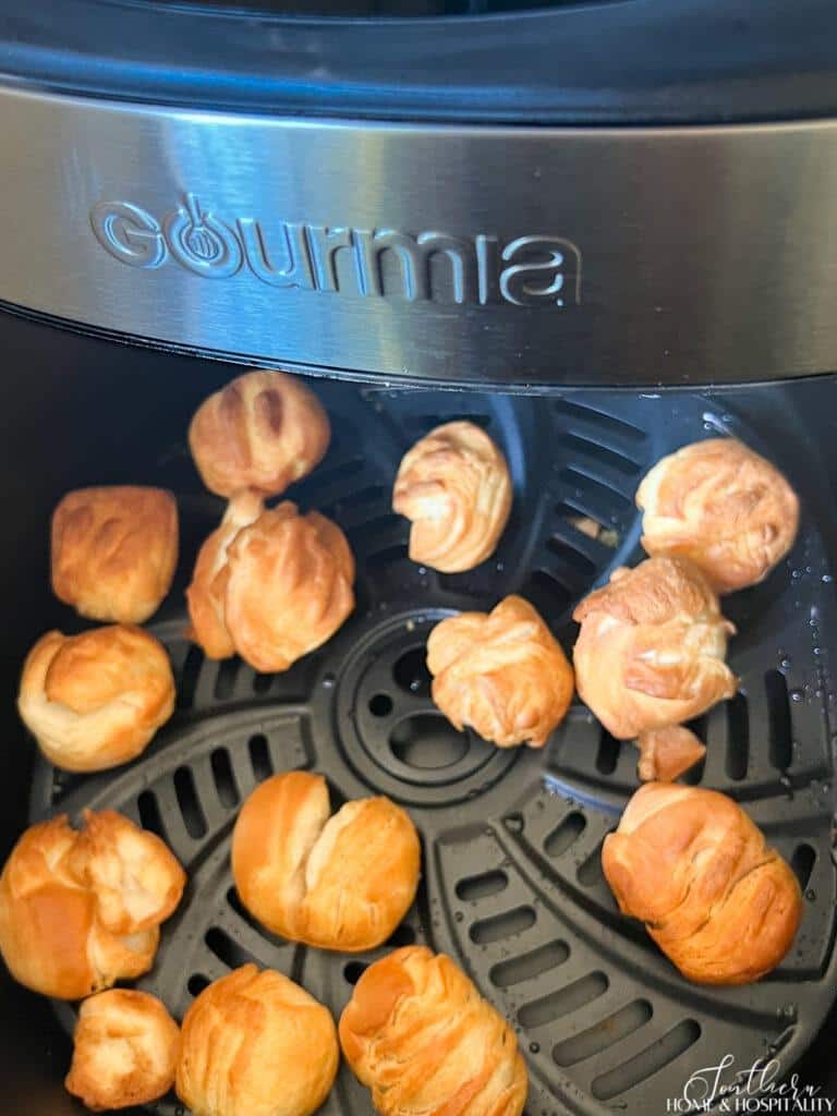Fried biscuit beignets in air fryer basket