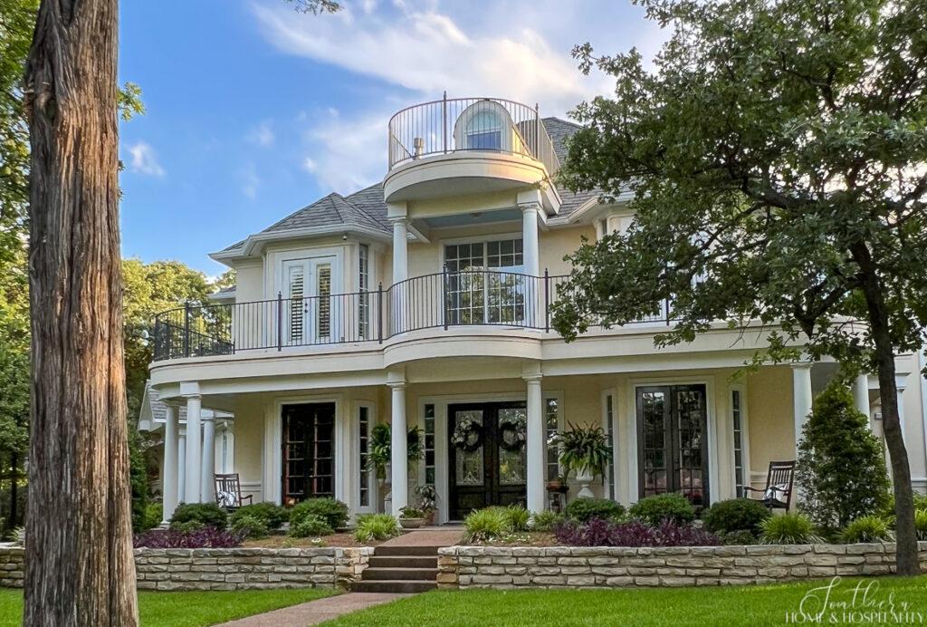 Southern Home and Hospitality southern style home with balconies, columns, and French doors