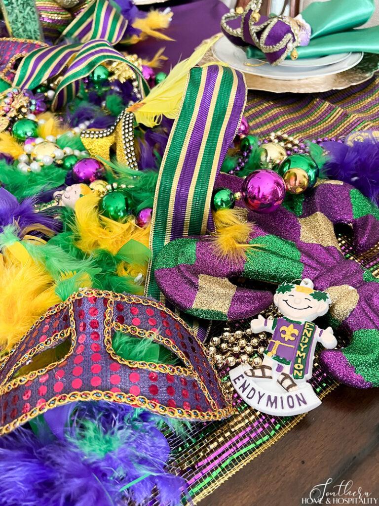 Endymion beads and mask in Mardi Gras table decor