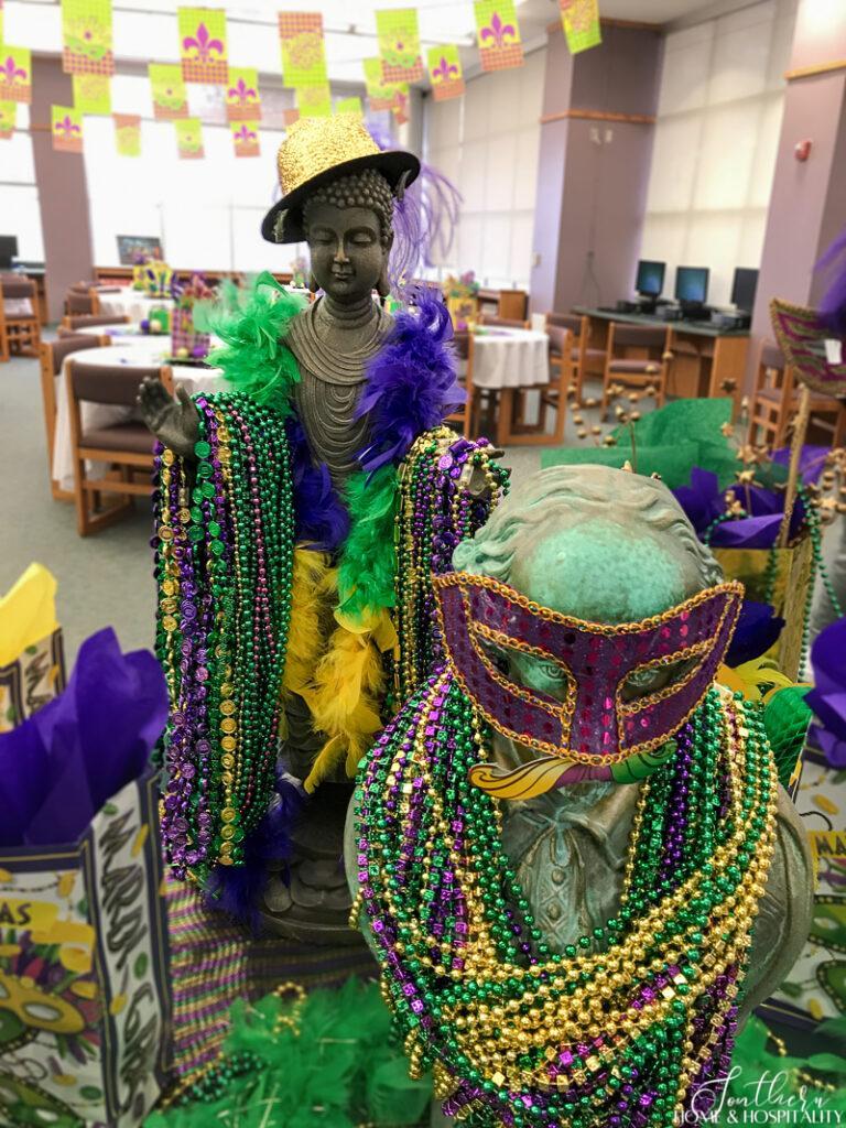 Bust and statue decorated for Mardi Gras