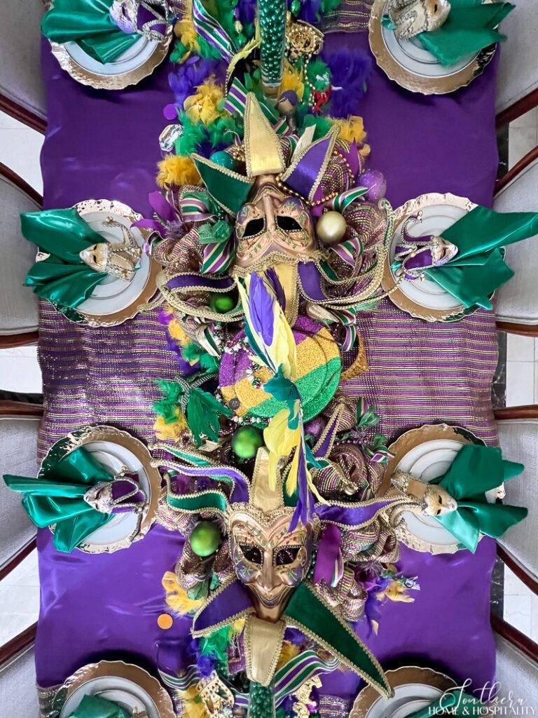 Mardi Gras centerpiece with jester masks on wreaths