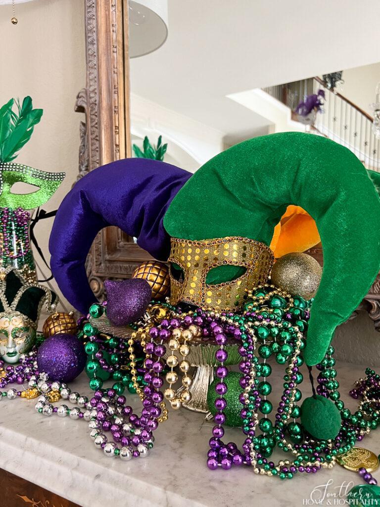 Jester hat with mask and beads in a bowl Mardi Gras centerpiece