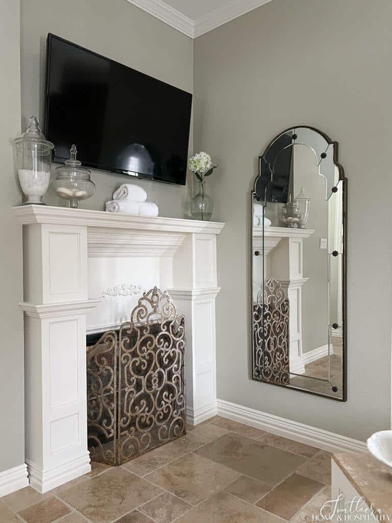 Bathroom fireplace with tv and full length mirror