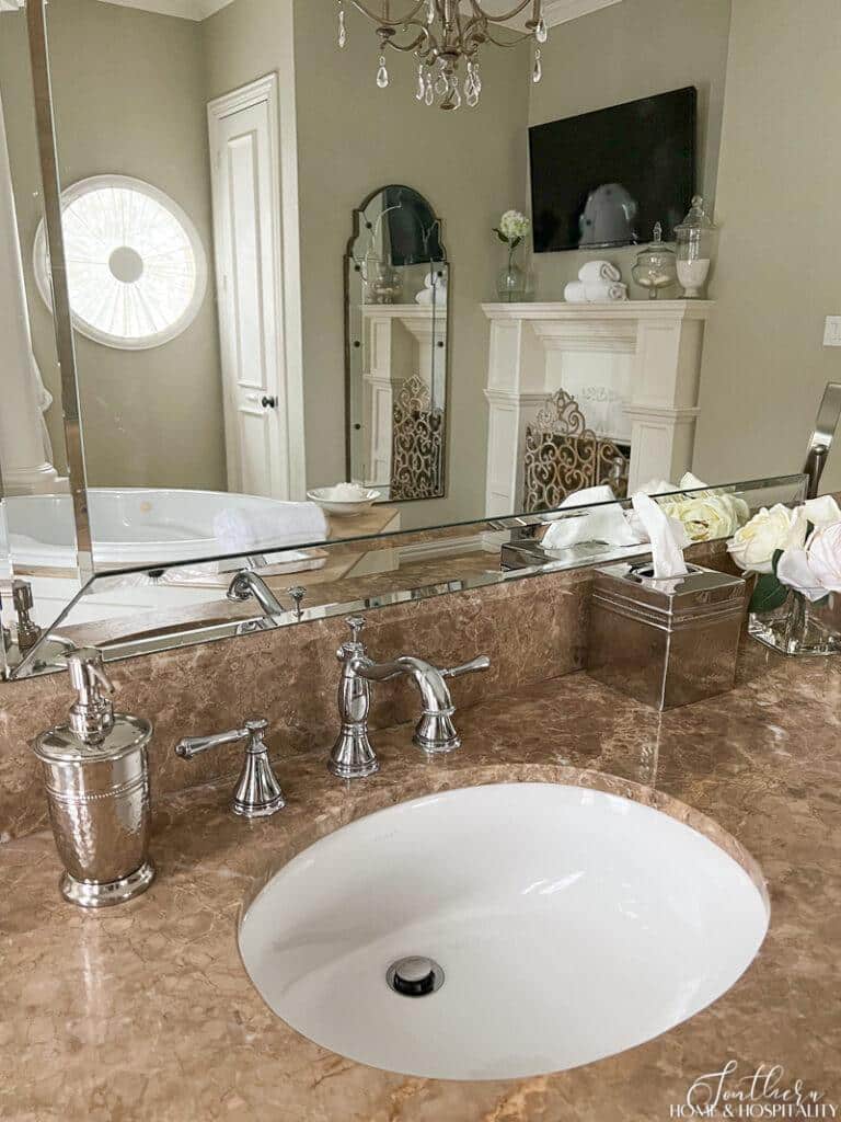 Bathroom sink and tan marble countertop