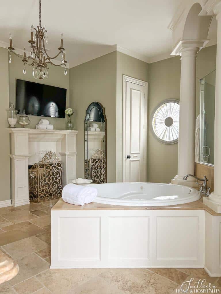 Classic primary bathroom with waincoating on tub surround