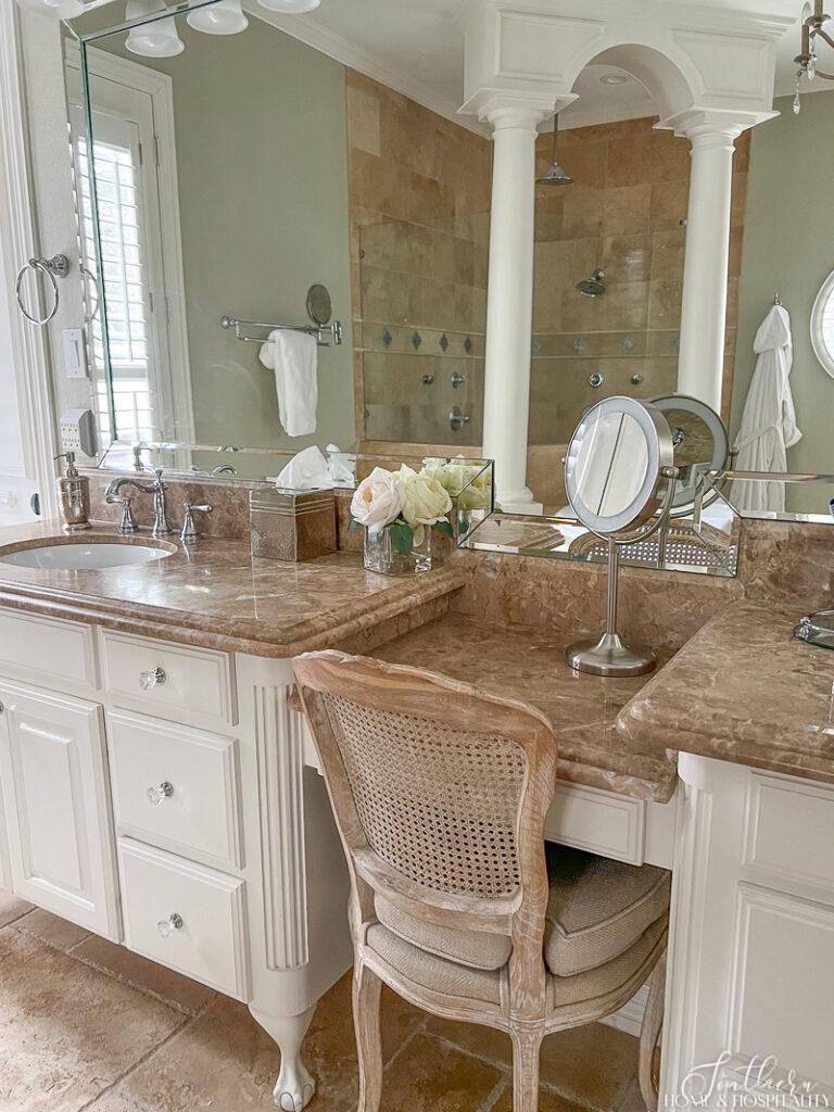 French bathroom vanity with light emperador marble and crystal drawer pulls