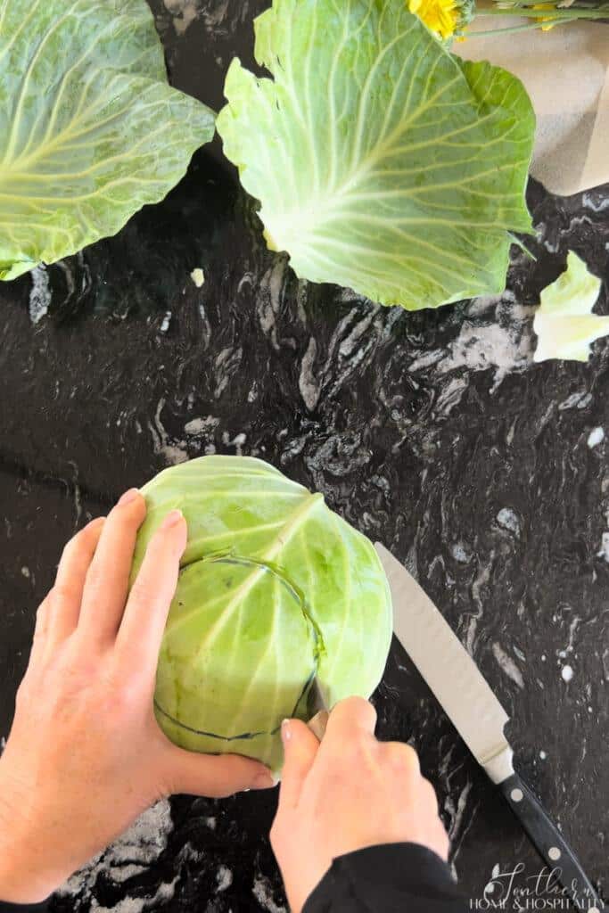 Cutting a hole in the cabbage along outline