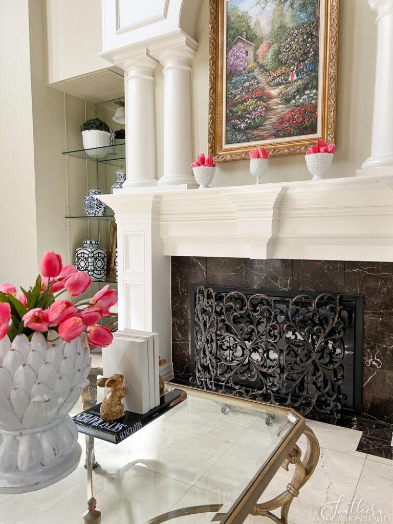 Spring mantel with pink tulips in milk glass