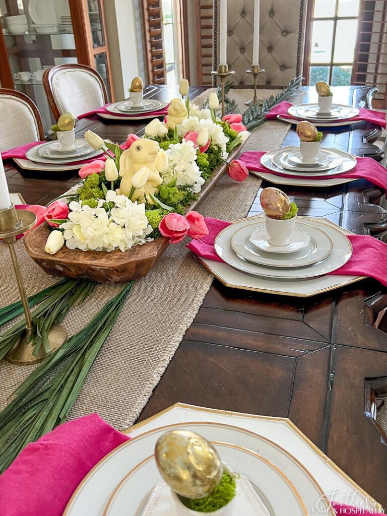 Easter dining table centerpiece and place settings with pink