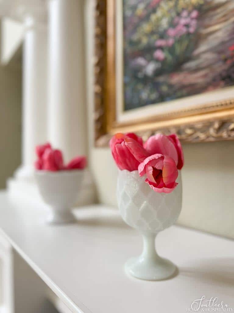 Milk glass goblet and pink tulips