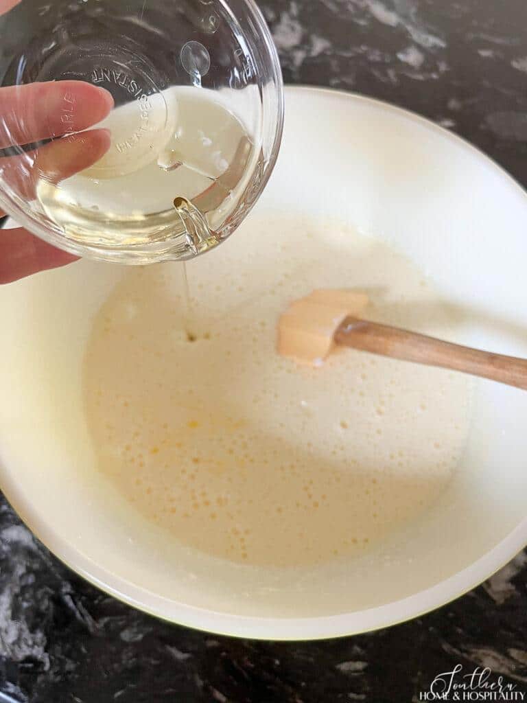 Adding oil to batter for lemon cake