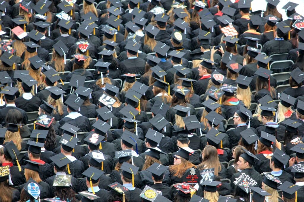 Decorated graduation caps during a ceremony