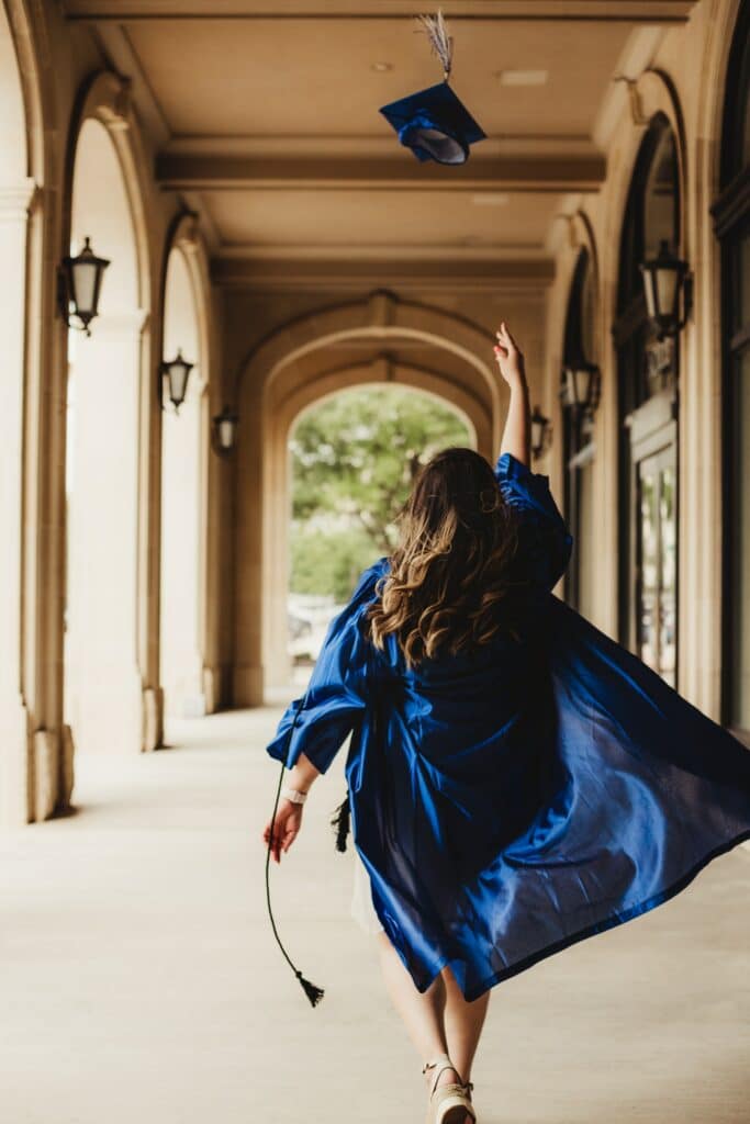 Graduate throwing cap