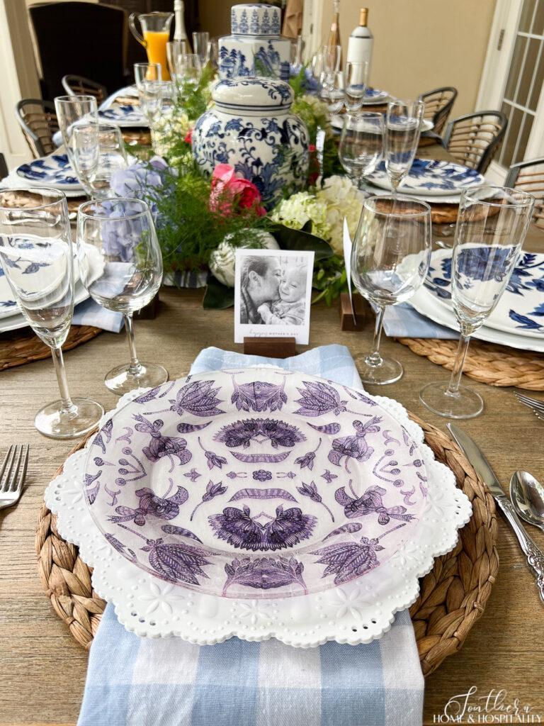 Blue and white pattern napkin decoupage plate in a table setting