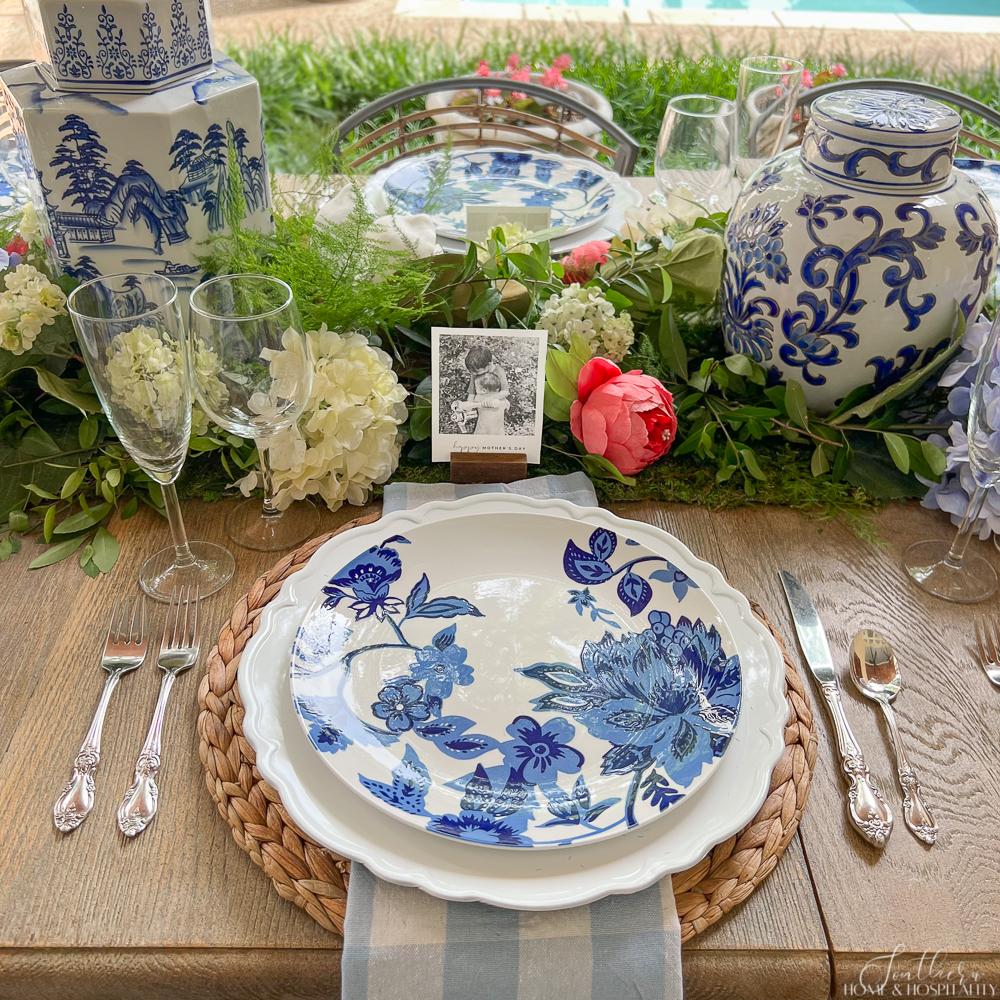 Mothers Day place setting with blue and white plate and napkin and photo place card