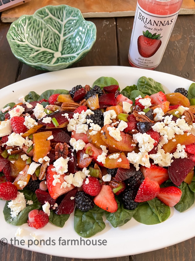 Beet salad with goat cheese, spinach, and berries