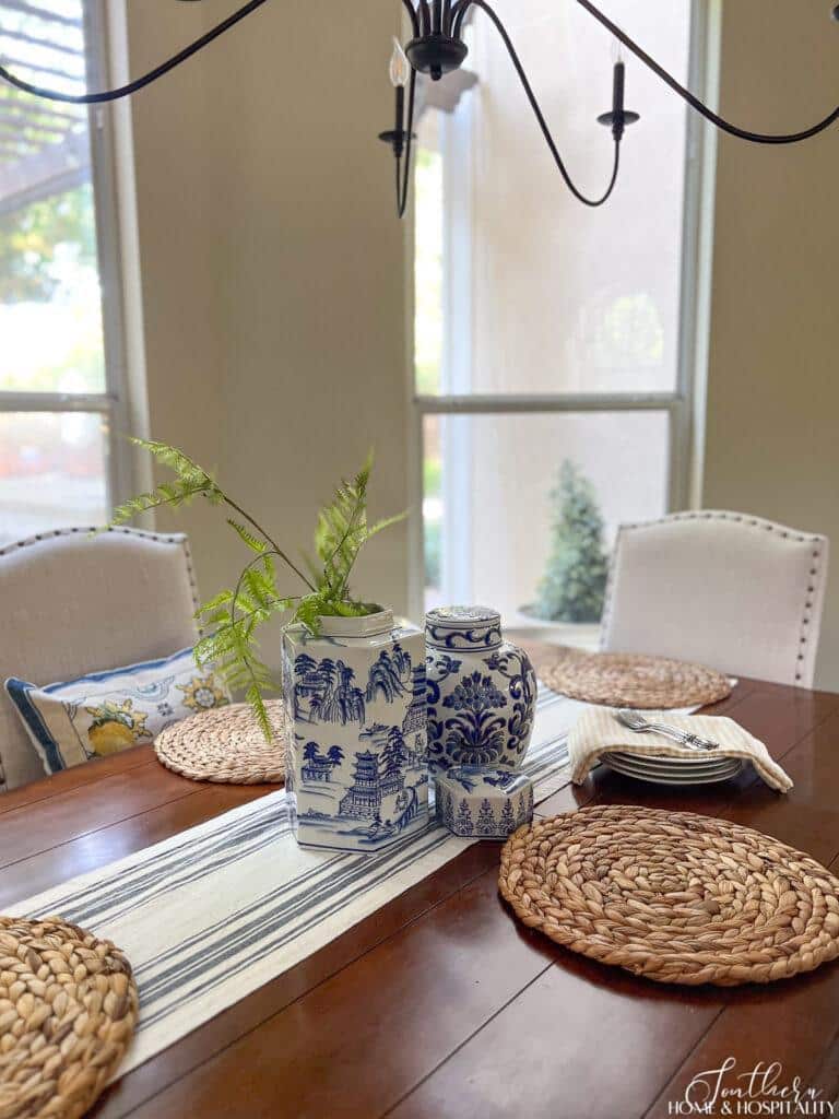Blue and white chinoiserie ginger jars on summer kitchen table
