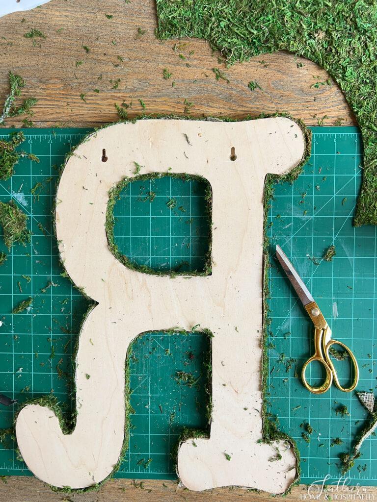 back of moss initial letter