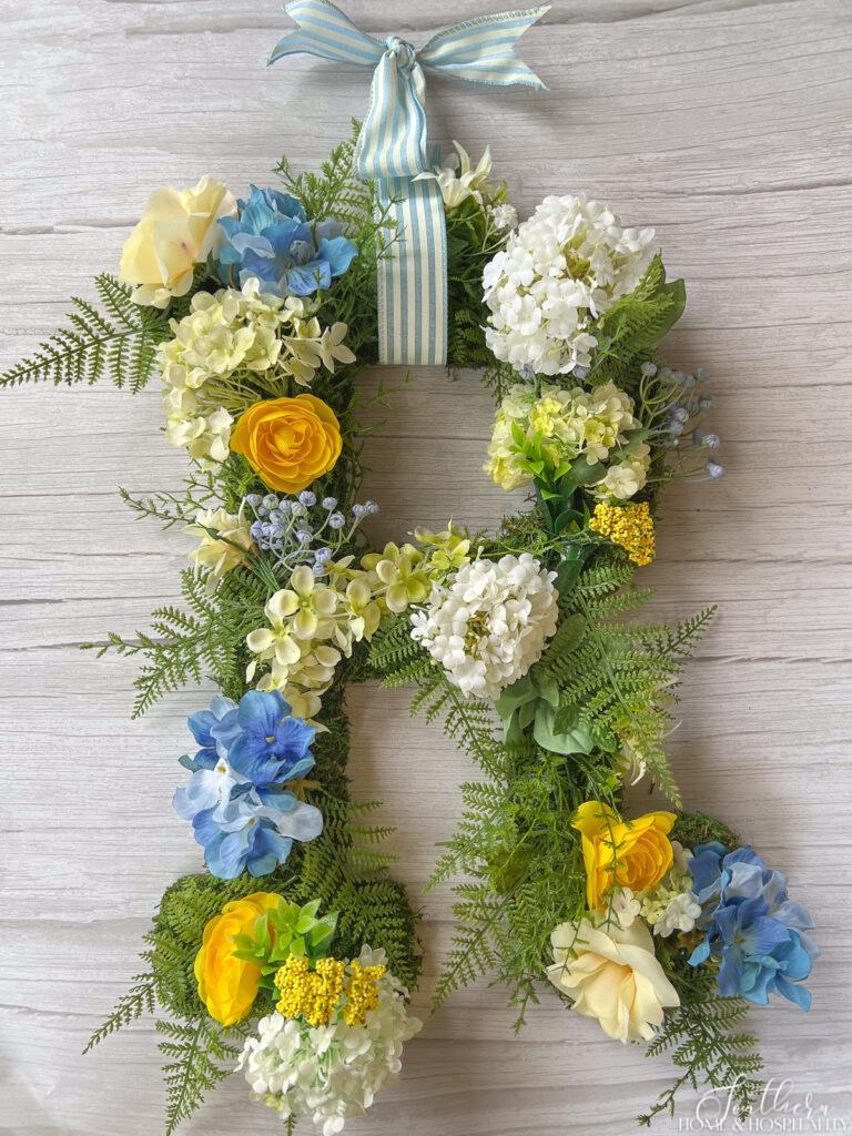 DIY floral initial wreath with flowers and ferns