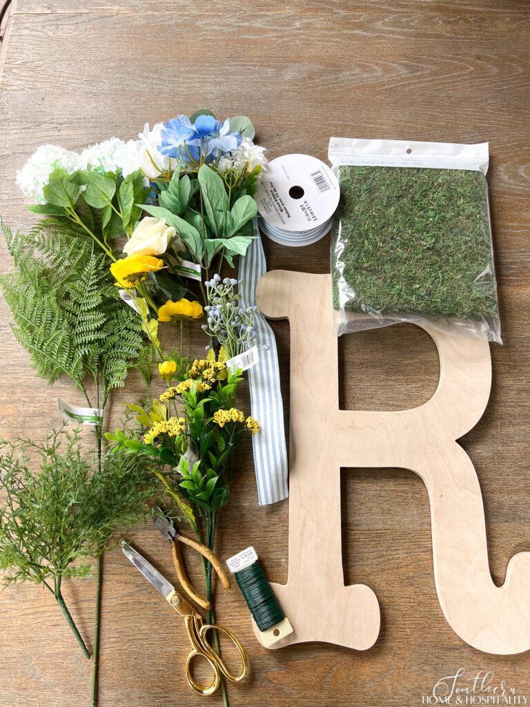 Supplies to make a monogram wreath with wood letter