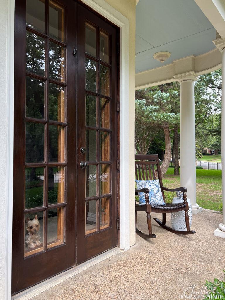 Stained wood French doors on front porch
