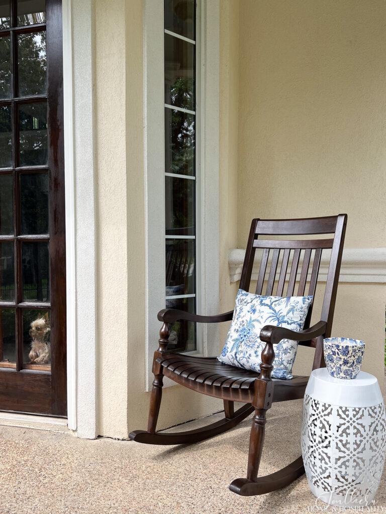 Stained wood rocker on front porch