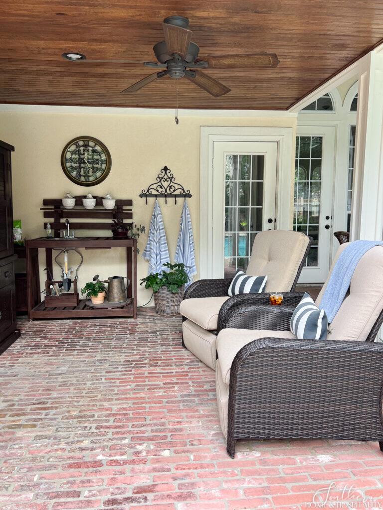 Outdoor wicker recliners on covered patio