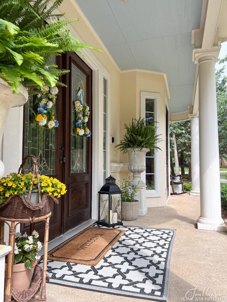 Southern front porch with haint blue ceiling and columns