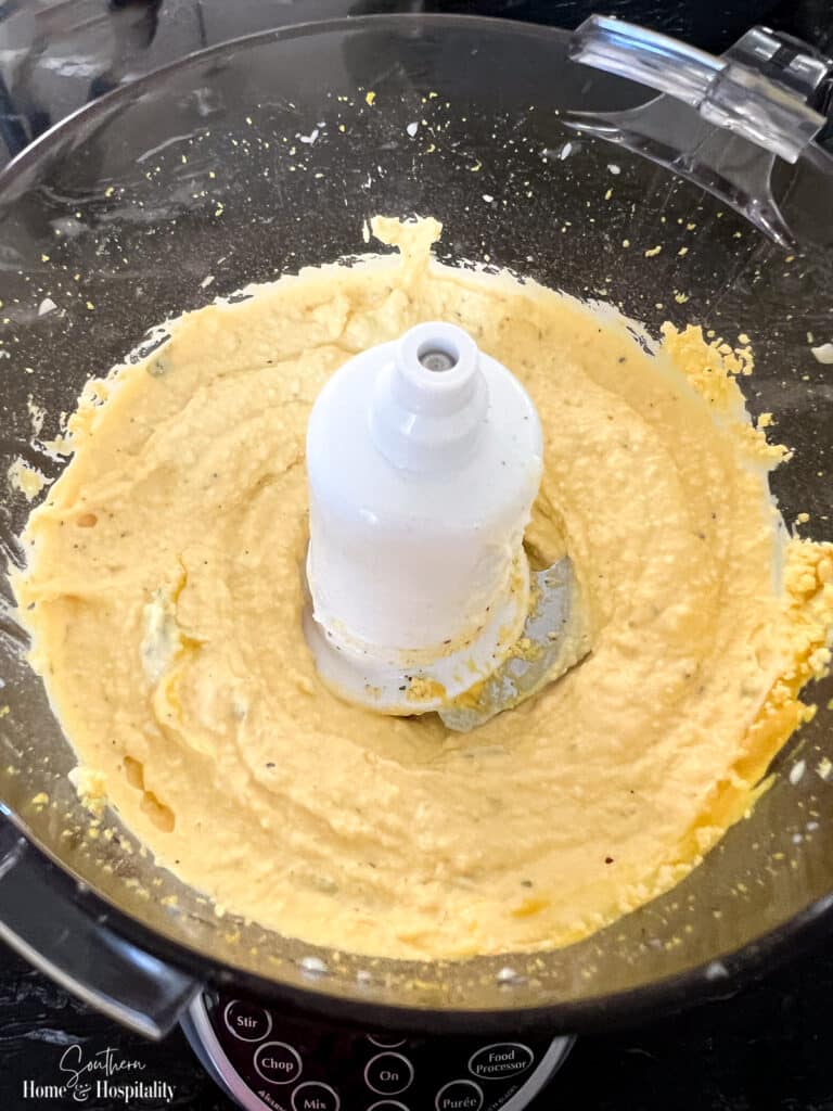 Deviled egg filling in food processor bowl