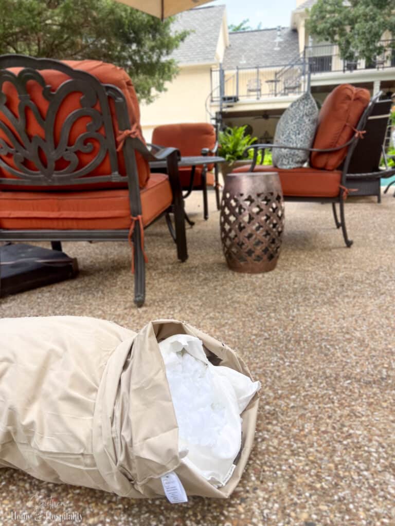 Torn open pillow for squirrels on patio