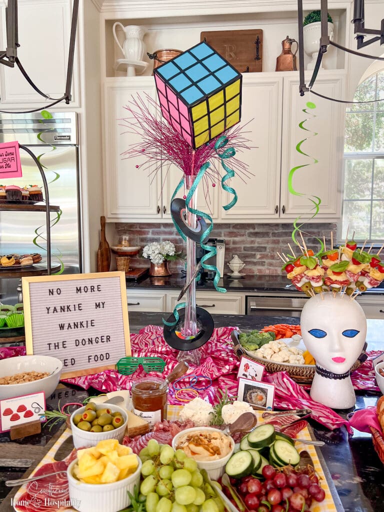 80s appetizer buffet with Rubiks Cube centerpiece