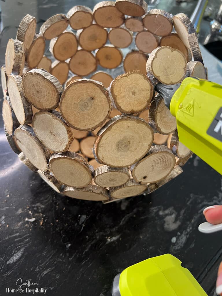 Hot glueing wood slice vase