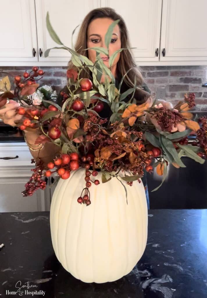Fall flower arrangement in pumpkin vase