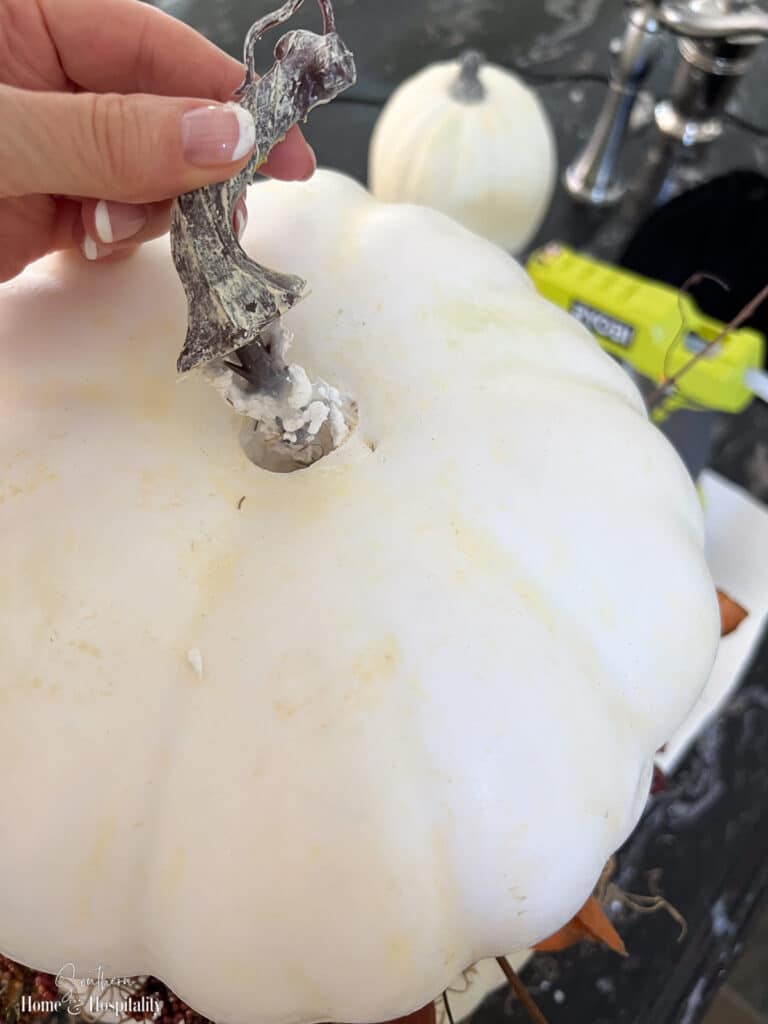 Removing stem from faux craft pumpkin to stack