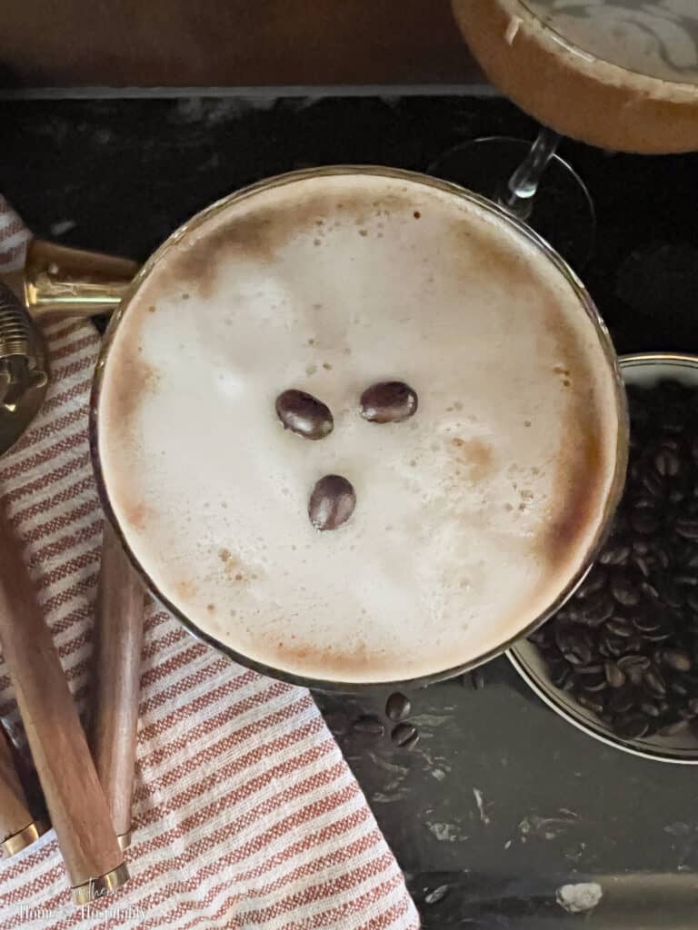 Top of an espresso martini with three coffee beans